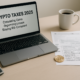 Laptop reading Crypto Taxes 2025 with tax forms and coffee