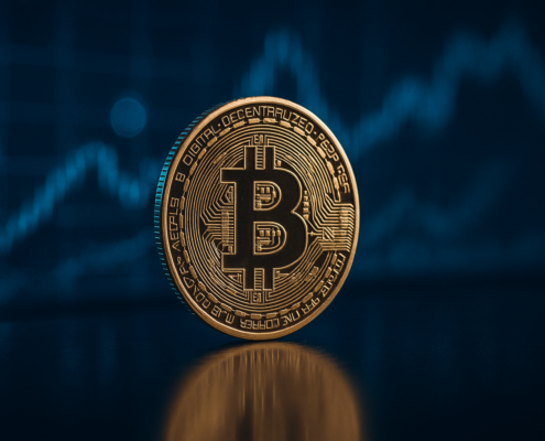 Golden Bitcoin coin in front of blue financial chart background